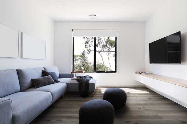 MSI Surfaces LVP – Brown by MSI Surfaces, brown luxury vinyl tile flooring, shown in a room setting (manufacturer image)